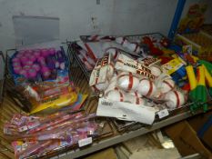Three Baskets Containing Party Accessories; England Balls, Flamethrower Rockets, Pens and Bubble