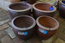 *Four Assorted Planters