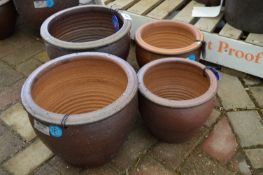 *Four Assorted Planters