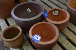 *Four Assorted Planters