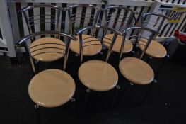 *Seven Tubular Chrome Frame Stackable Cafe Chairs with Simulated Beech Seats