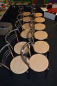 *Seven Tubular Chrome Frame Stackable Cafe Chairs with Simulated Beech Seats
