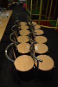 *Seven Tubular Chrome Frame Stackable Cafe Chairs with Simulated Beech Seats