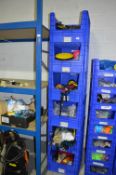 *Six Stackable Blue Crates Containing Assorted Stilt Parts and Accessories