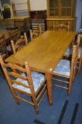 Pine Dining Table and a Set of Six Chairs