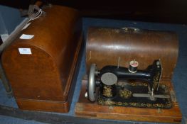Two Wood Cased Singer Sewing Machines