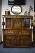 Oak Refectory Sideboard with Carved Panel Doors