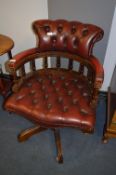 Burgundy Leather Upholstered Captains Chair