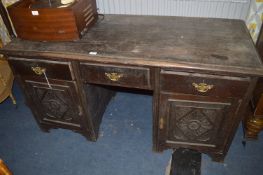 Oak Pedestal Desk with Carved Panel Doors