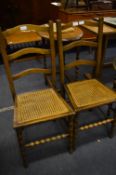 Pair of Oak Cane Seated Dining Chairs on Bobbing Legs