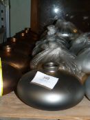 *Seven Gunmetal Coloured Vases