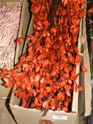 *Box Containing Artificial Red Palm Lilies