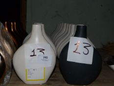 *Twenty Five Cream Vases and One Black Vase