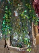 *Box Containing Artificial Green and Blue Palm Lily Flowers