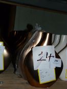 *Twelve Tall Bronze Vases