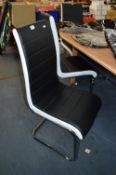*Set of Six Black and White Leatherette Chairs on Chrome Bases