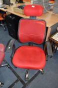 *Red Upholstered Swivel Armchair