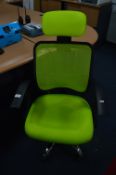 *Green Upholstered Swivel Armchair