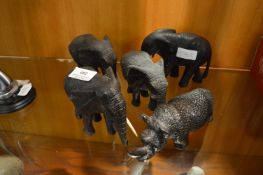 Collection of Four Carved Wood Elephants and a Rhino