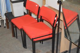 Four Stackable Red Office Chairs