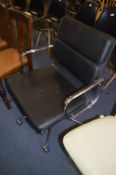 Black Upholstered and Chrome Swivel Office Armchair