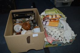 2 Boxes Containing Cutlery, Photo Frames, Pottery & Table Linen