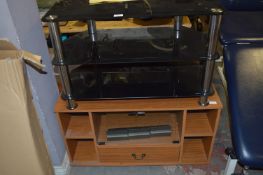 Black Glass TV Stand and a Teak TV Cabinet
