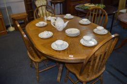 Oak Extending Dining Table and Four Stickback Dining Chairs