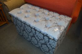 Blue Upholstered Ottoman and Contents of Bed Linen