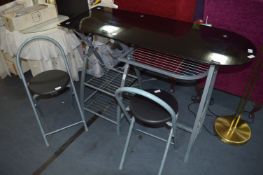 Black Glass Topped Wrought Metal Kitchen Stand with a Pair of Folding Stools