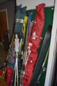 Large Quantity of Skis and a Pair of Ski Boots