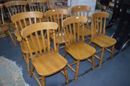 Four Beech Slatback Dining Chairs and Two Carvers