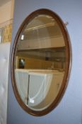 Oval Oak Framed Bevelled Edge Wall Mirror