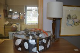 Chrome and Black Ceiling Light Fitting and a Light Oak Table Lamp