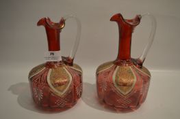 Pair of Gilt Decorated Ruby Glass Jugs