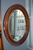 Oval Mahogany Framed Bevelled Edge Wall Mirror