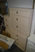 Two Cream Three Drawer and a Pair of Two Drawer Cabinets
