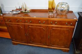 Walnut Veneered Three Door, Three Drawer Sideboard