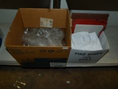 Box of Transparent Lids and a Box Containing Cheese Wire, Table Cloths, Chopping Boards, etc.