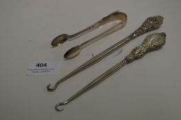 Pair of Silver Handled Button Hooks and Silver Sugar Tongs