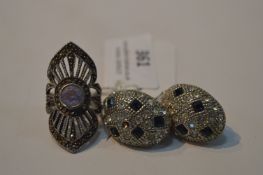 Pair of Earrings with Blue and Clear Cut Stones and a White Metal Ring Set with Large Stone