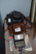 Two Vintage Cameras and a Flash