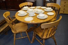 Pine Circular Topped Dining Table on Pedestal Base with Four Stickback Dining Chairs