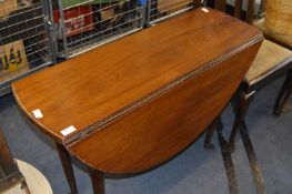 Mahogany Oval Topped Drop Leaf Dining Table on Cabriole Legs