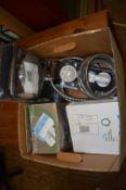 *Box Containing Various Shower Components Including Hoses and Heads