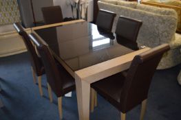 Light Oak Framed Glass Topped Extending Dining Table and Six Brown Leatherette Dining Chairs