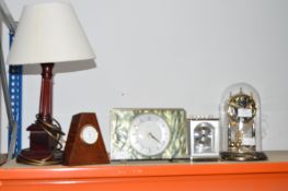 Four Mantel Clocks and a Table Lamp