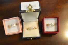 Three White Metal Dress Rings Set with Stones