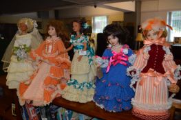 Three Porcelain Dolls and Two Plastic Dolls