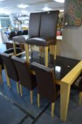 Light Oak Framed Black Glass Topped Extending Dining Table and Six Brown Leatherette Chairs